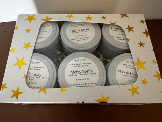 Set of candles in a decorative box with star patterns